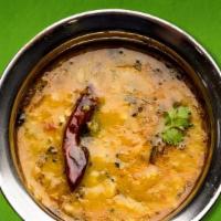 Yellow Dal · Vegan, gluten free. Tender lentils stewed in a savory curry and served with a side of basmat...