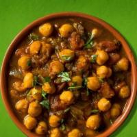 Chana Masala · Vegan, gluten free. Chickpeas simmered in a tomato stew served with a side of basmati rice.