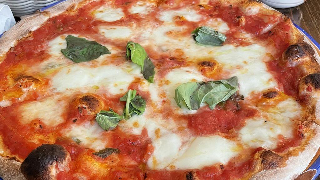 Margherita Pizza · Tomato sauce, mozzarella fior di latte and basil.