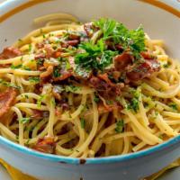 Spaghetti Alla Carbonara · Italian smoked pancetta with onions, egg yolk, and parmigiano reggiano cheese.