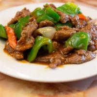 Pepper Steak C青椒牛 · Stir fried steak with vegetables and a savory sauce.