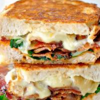 #2. Sweet Baked Bacon Grilled Cheese · Freshly sliced avocado, sweet baked bacon, white Cheddar cheese. Fontina cheese. Sun-dried t...