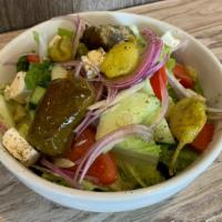 Greek Salad · Lettuce, tomatoes, cucumbers, stuffed grape leaves, red onions, pepperoncini, feta, and kala...