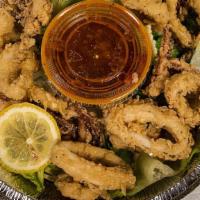Fried Calamari · Hand breaded and cooked to a golden crisp. Served with marinara sauce.