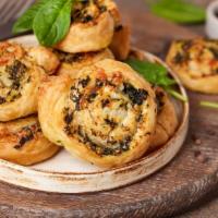 The Spinach Roll · Our fresh, made daily pizza dough rolled around fresh spinach and mozzarella cheese and bake...