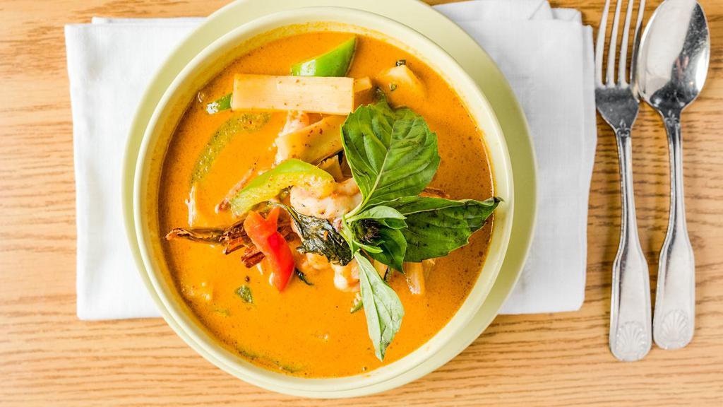 Red Curry · Hot. A popular thai dish consisting of spicy bold taste of dried red chill paste in coconut milk, bamboo shoot, bell pepper, eggplant and basil.