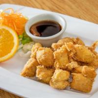 Crispy Tangy Chicken · Deep fried battered marinated chunk chicken breast served with tangy orange flavor sauce.