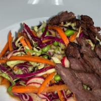 Far East Sliced Steak Salad · Cabbage, Edamame, Shredded Carrots, Sunflower Seeds, French Radish, Sesame Teriyaki Vinaigre...