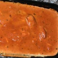 Butter Chicken · Boneless chicken cooked in mildly spiced cream sauce with tomato and ghee-purified butter.