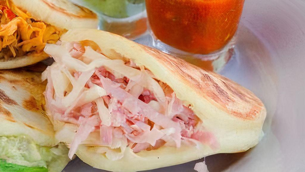 Arepa De Jamón Y Queso · Ham and cheese.