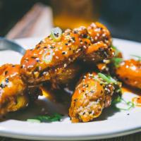 Chicken Wings · Organic wings, Honey Sriracha sauce, sesame seeds, buttermilk dipping sauce