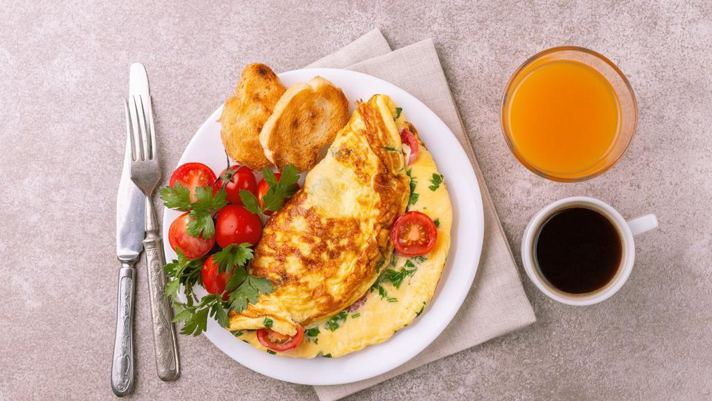 Mardi Grass Omelette Platter · Fresh served scrambled eggs omelette with ham, bacon, tomatoes and cheddar cheese. Served with home fries & toast.