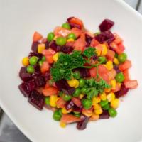Beet Salad · Served with green peas, roasted corn, and chopped tomatoes in a tomato vinaigrette.