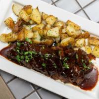 Hanger Steak Angus · Mushrooms, roasted potatoes, and bordelaise sauce.