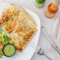 Fajita Quesadilla · Cheddar and monterrey jack cheeses chicken peppers and onions.
