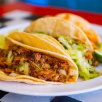 Smoked Pork Soft Taco · Seasoned tender pork with grilled scallions, and arbol salsa. All topped with onions and cil...