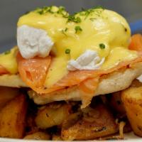 Eggs Norwegian · Smoked salmon, poached eggs and hollandaise over an English muffin, with home fries.
