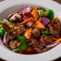 Beef Black Peppers · Beef, bell peppers, carrot and onions stir fried black pepper sauce.
