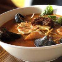 Mixed Seafood Curry Laksa · Hot & spicy. Lemongrass, curry soup, hardboiled egg, mint leaves, scallions with egg noodles.