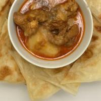Chicken Curry Palata · Palata with chicken & potato curry.