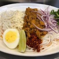 Nan Gyi Thoke · Thick Rice Noodles with Chicken, Roasted Bran Powder, Onion, Cilantro, , Egg, Lime, Chili Fl...