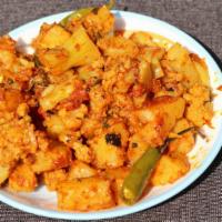 Aloo Gobi · Fresh cauliflower mixed with ground spices and small pieces of potatoes.