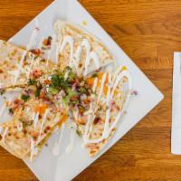 Quesadillas · Tortilla with jack cheese, served with Jimmy’s homemade guacamole, sour cream, and salsa.