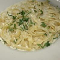 Fettuccini Alfredo · Linguini tossed in rich parmesan cream sauce.