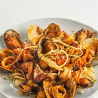 Seafood Fra Diavolo · Lobster tail, shrimp, mussels, and clams served over choice of rice or pasta. Served with so...