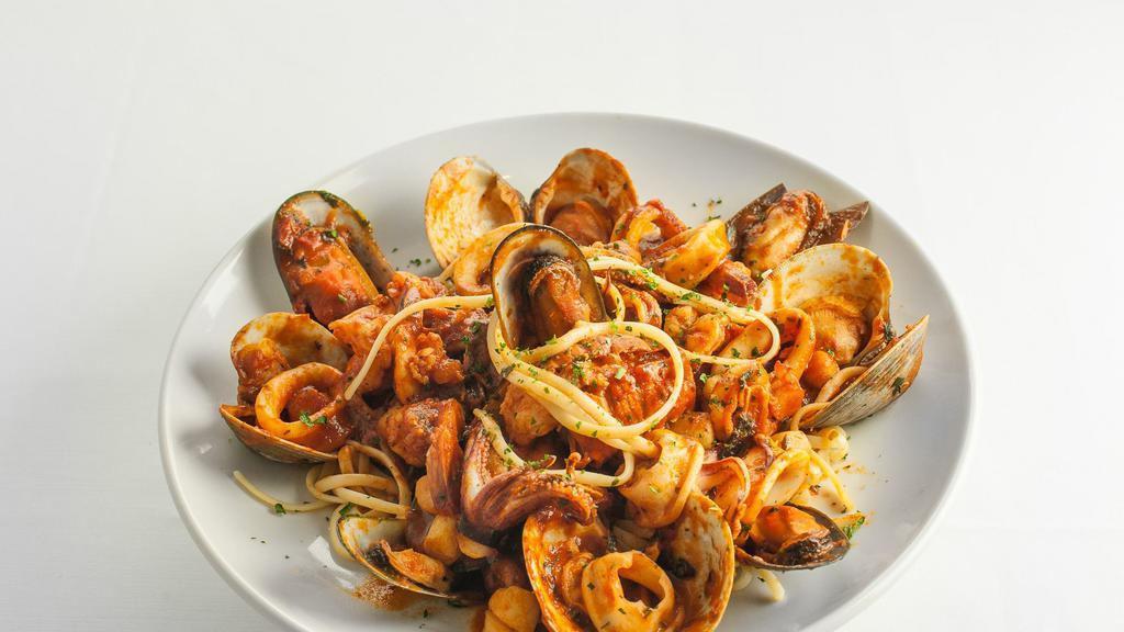 Seafood Fra Diavolo · Lobster tail, shrimp, mussels, and clams served over choice of rice or pasta. Served with soup or salad.