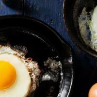Extra Fried Eggs · side of fried brown eggs