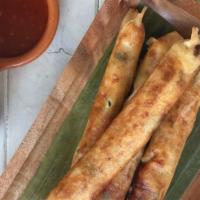 Lumpiang Shanghai · our filipino spring rolls! Ground pork and vegetable , with sweet chilli sauce.