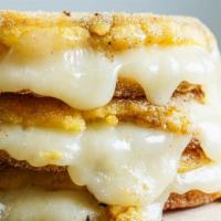 Arepa Con Queso · Sweet corn, cheese and butter.