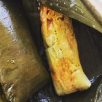 Tamales · Traditional masa with chicken or pork filling.
