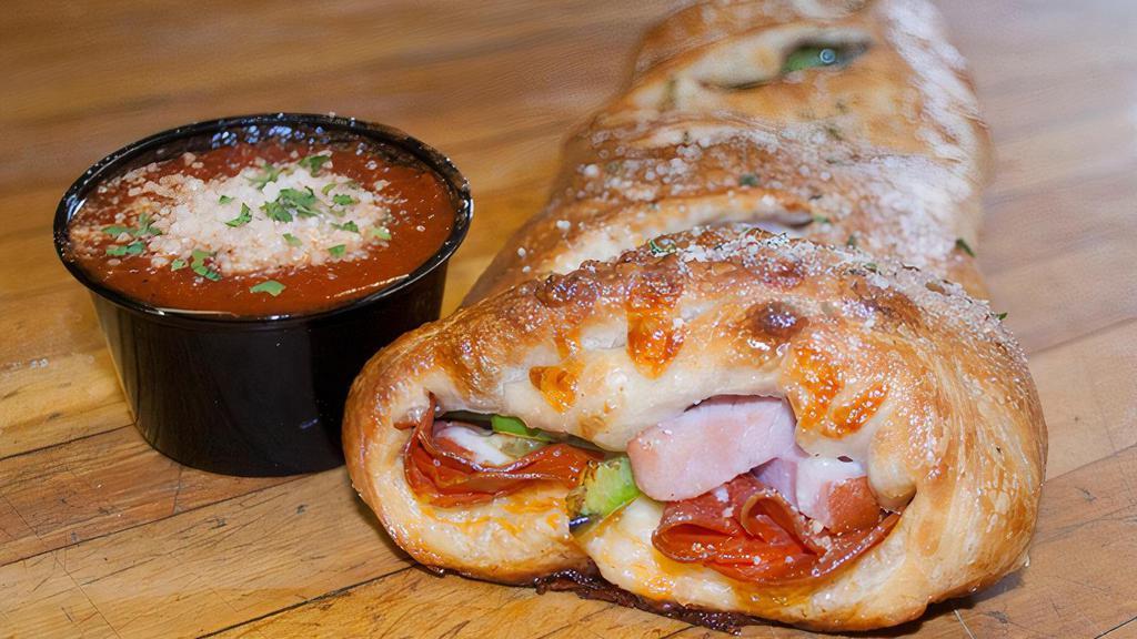 Traditional Stromboli · Pepperoni, Virginia baked ham, green peppers and mozzarella cheese.