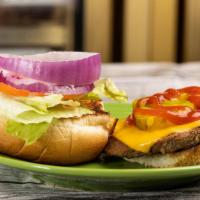Beef Hamburger Deluxe · Beef Hamburger Patty with cheese, lettuce, tomato, onions, pickles on a sesame seed bun, ser...