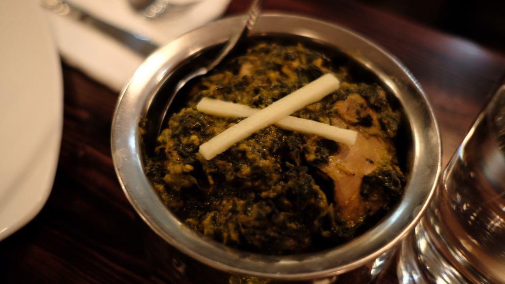 Chicken Saag · Chicken cooked with spinach. Served with basmati rice on side.