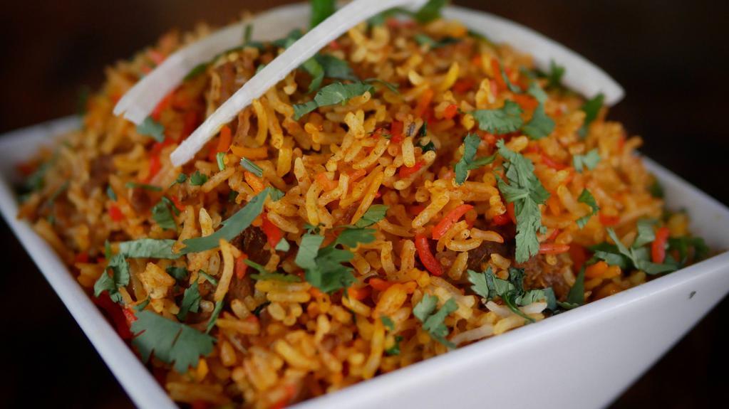 Lamb Biryani · Slowly cooked rice with lamb and spices.