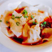 Wonton In Hot Sesame Sauce · Hot and spicy. Contains peanut sauce.