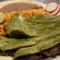 Cecina Con Nopales · Salted beef with grilled cactus. It is served with rice, beans, and tortillas on the side.