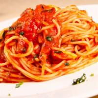 The Spaghetti · Fresh made marinara, parmesan cheese, and basil sitting on a bed of fresh made spaghetti.