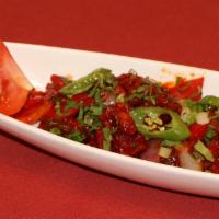 Chilli Chicken · Deep fried chicken pieces tossed in a chili sauce with onions and green bell peppers