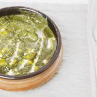 Palak Tandoor Paneer · Tandoori cooked cottage cheese simmered in cumin tempered spinach gravy cream.