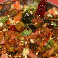 Vendakkai Masala · Vegan. Okra sautéed with onion, tomatoes, roasted ground spices.