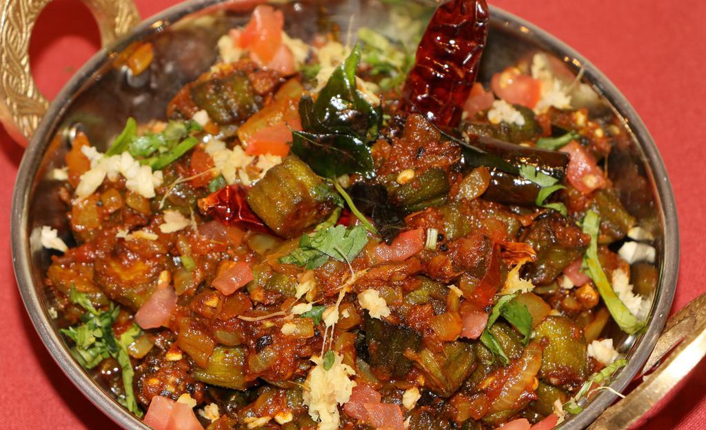 Vendakkai Masala · Vegan. Okra sautéed with onion, tomatoes, roasted ground spices.