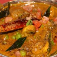 Kaalan Pattani Milagu Curry · Vegan. Button mushrooms, green peas in a spicy black pepper sauce.