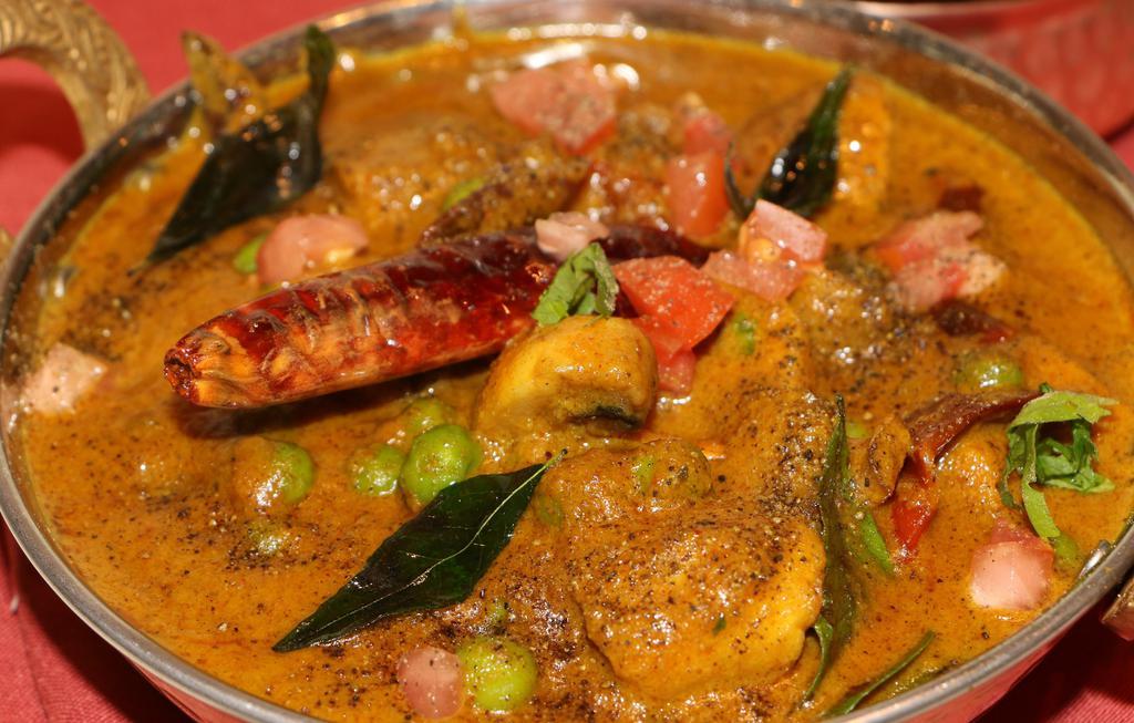Kaalan Pattani Milagu Curry · Vegan. Button mushrooms, green peas in a spicy black pepper sauce.