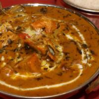 Murg Tikka Masala · Cubes of chicken char-grilled and cooked in a tomato creamy sauce.