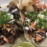 Carnitas Taco · Diced pork. With onions, tomatoes, cilantro, slice of lime, grilled onions, and green or red...