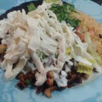 Burrito Bowl · Try taqueria's famous burrito bowl. Contains Mexican rice, black beans , tomatoes , sour cre...